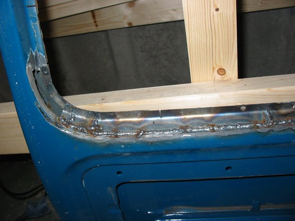 In it goes Capri rear screen frame repair panel welded in