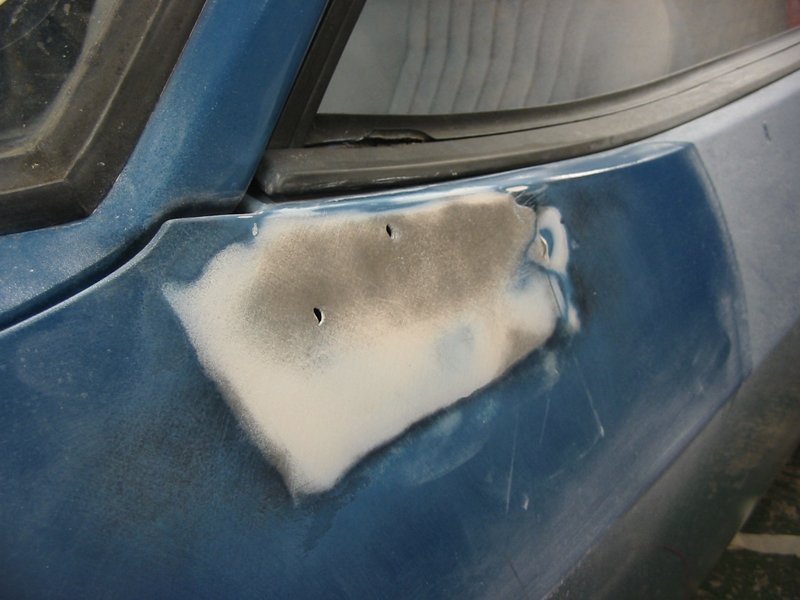 Capri door with new holes for bullet mirror