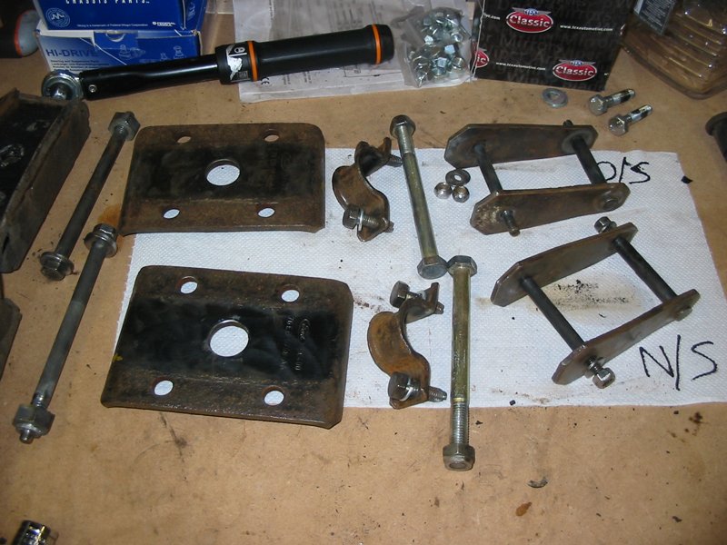 Capri rear spring shackles and saddle plates