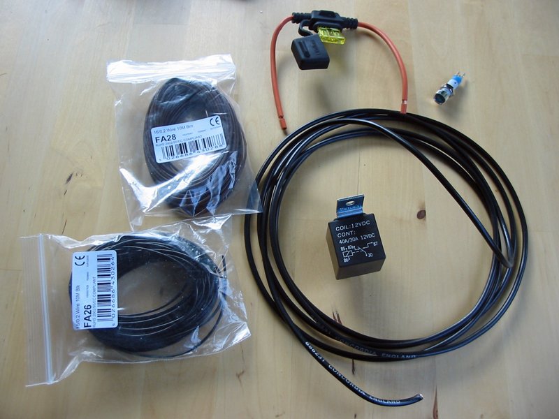 Bits from Maplins 30A relay, an in-line fuse holder with 20A fuse, some 30A and 3A wire and a panel-mount blue LED from Maplins