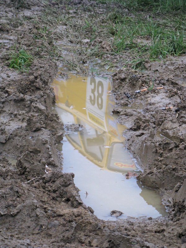 Arty Ford Escort Mk1 reflected in mud puddle at Santa Pod - Classic Ford 2008